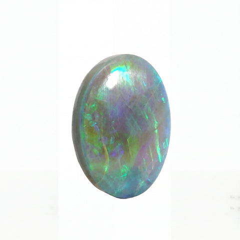 Multicoloured opal stone on a white background