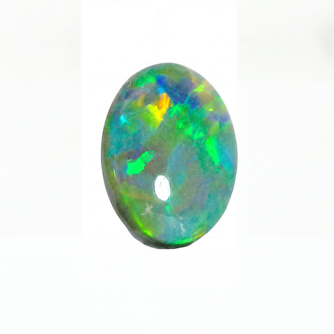 Oval-shaped opal gemstone with multicolour play on a white background