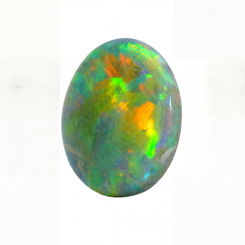Multicoloured opal stone on a white background