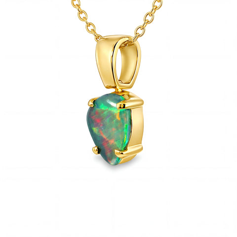 Gold pendant with a heart-shaped opal stone on a white background