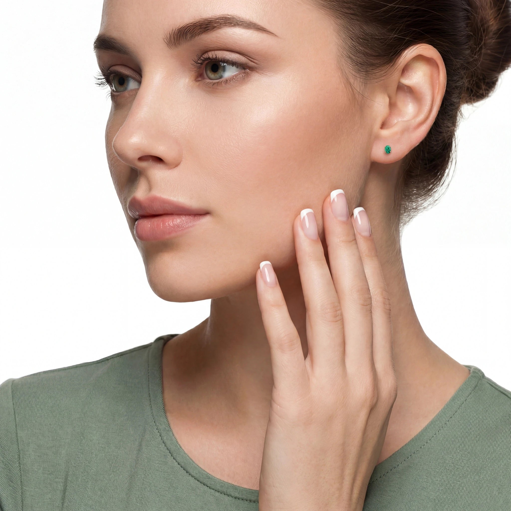 Woman touching her face wearing opal earrings