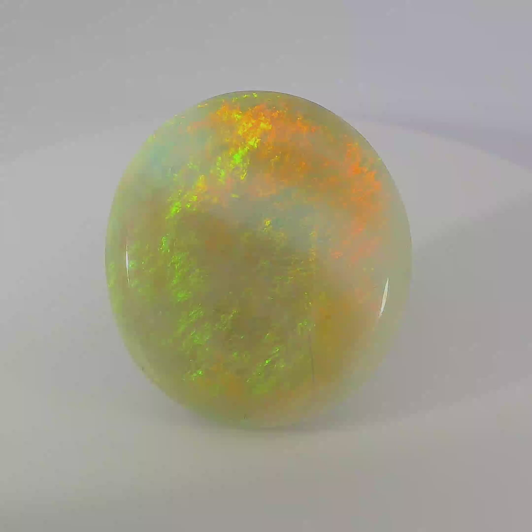 Vibrant Opal Gemstone in Hand