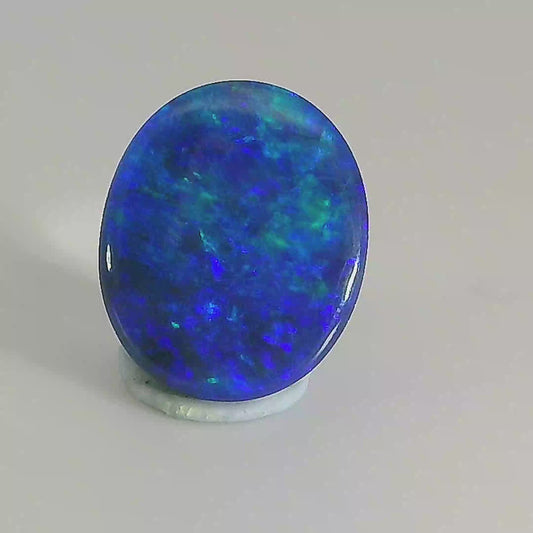 Video of an Oval-shaped blue opal gemstone on a white background