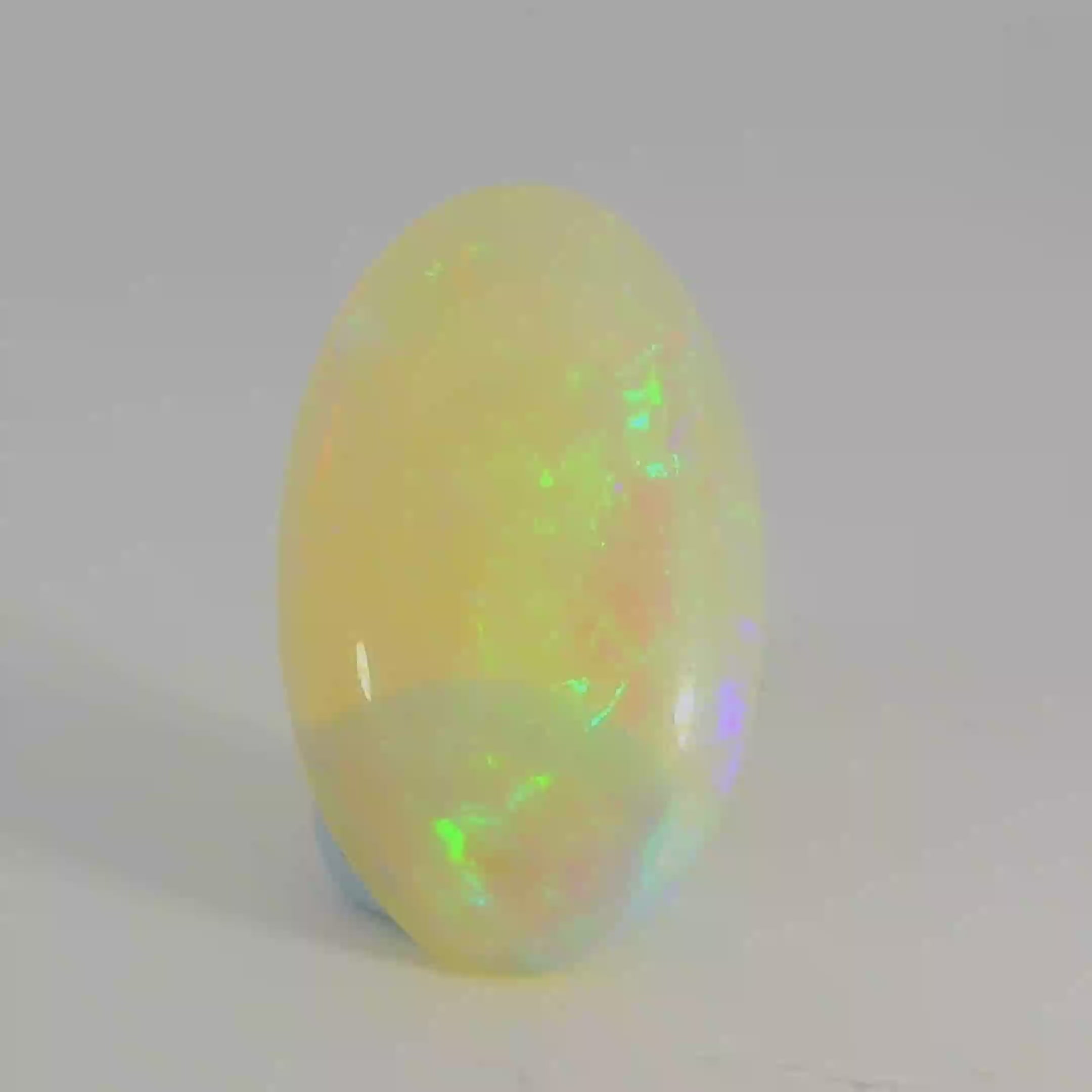 Vibrant Opal Gemstone in Hand