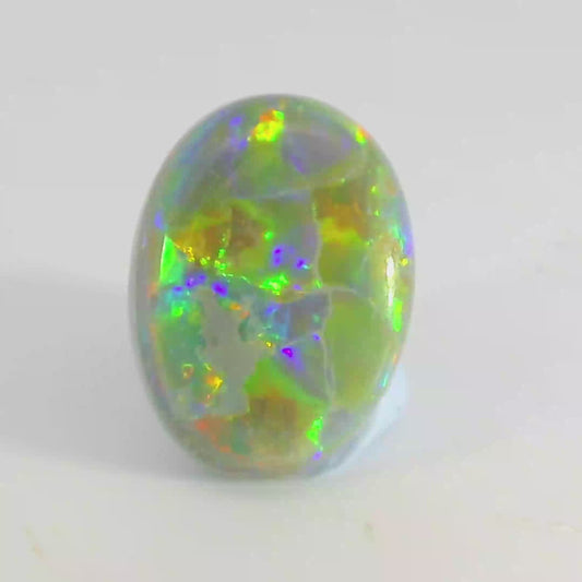 Video of a Multicoloured opal stone on a white background