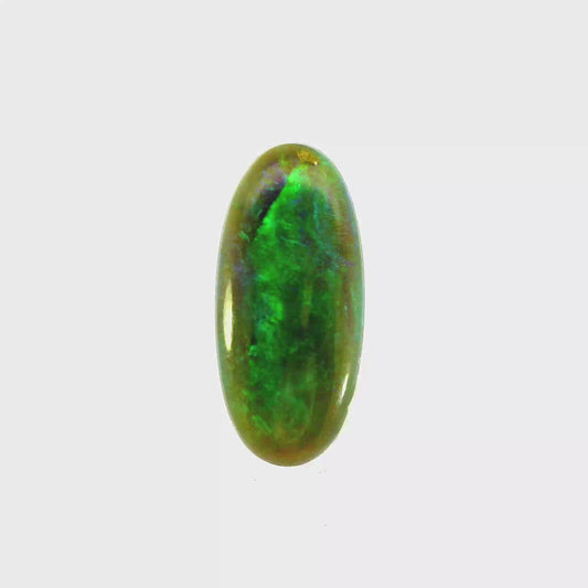 Video of an Multicoloured opal stone on a white background