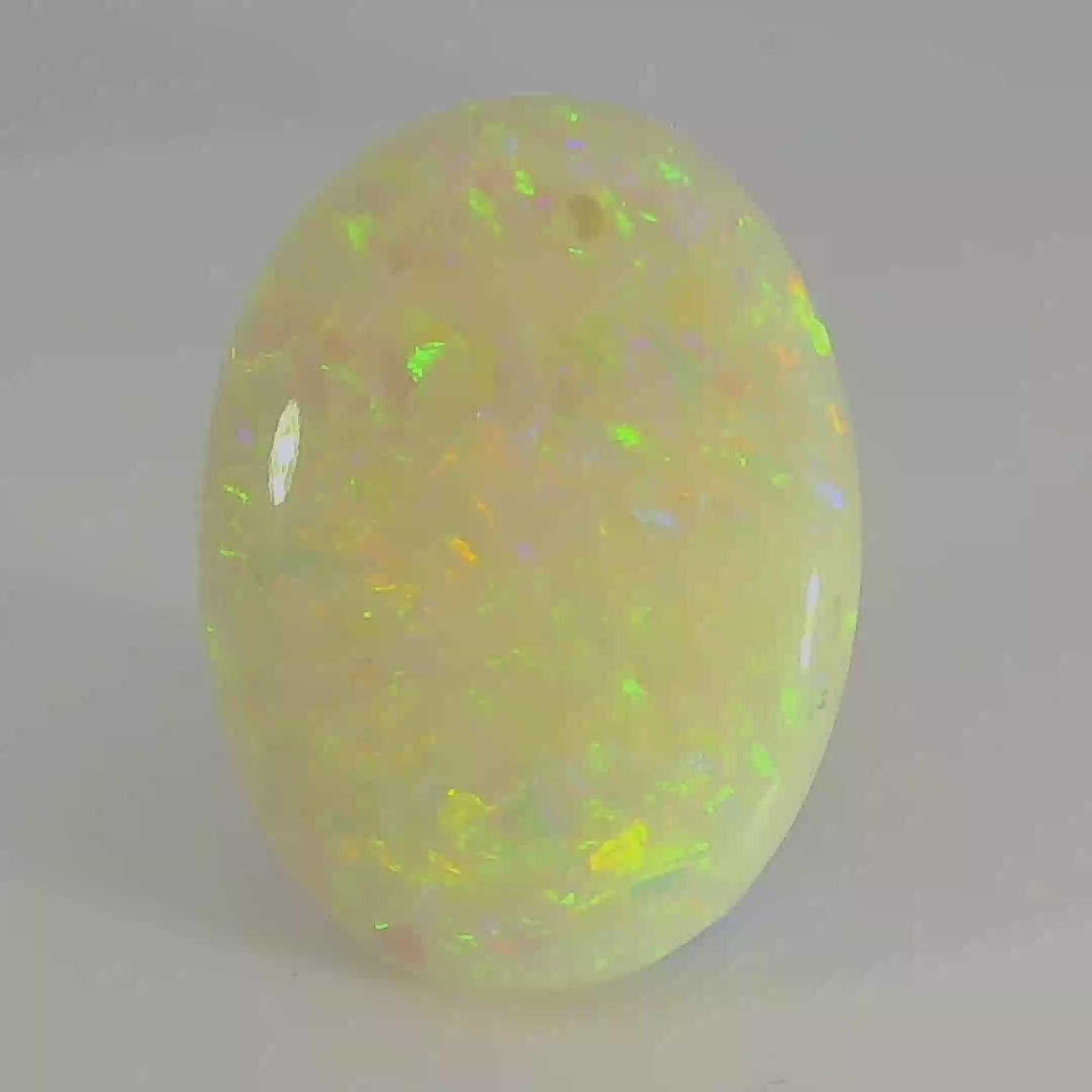 Vibrant Opal Gemstone in Hand