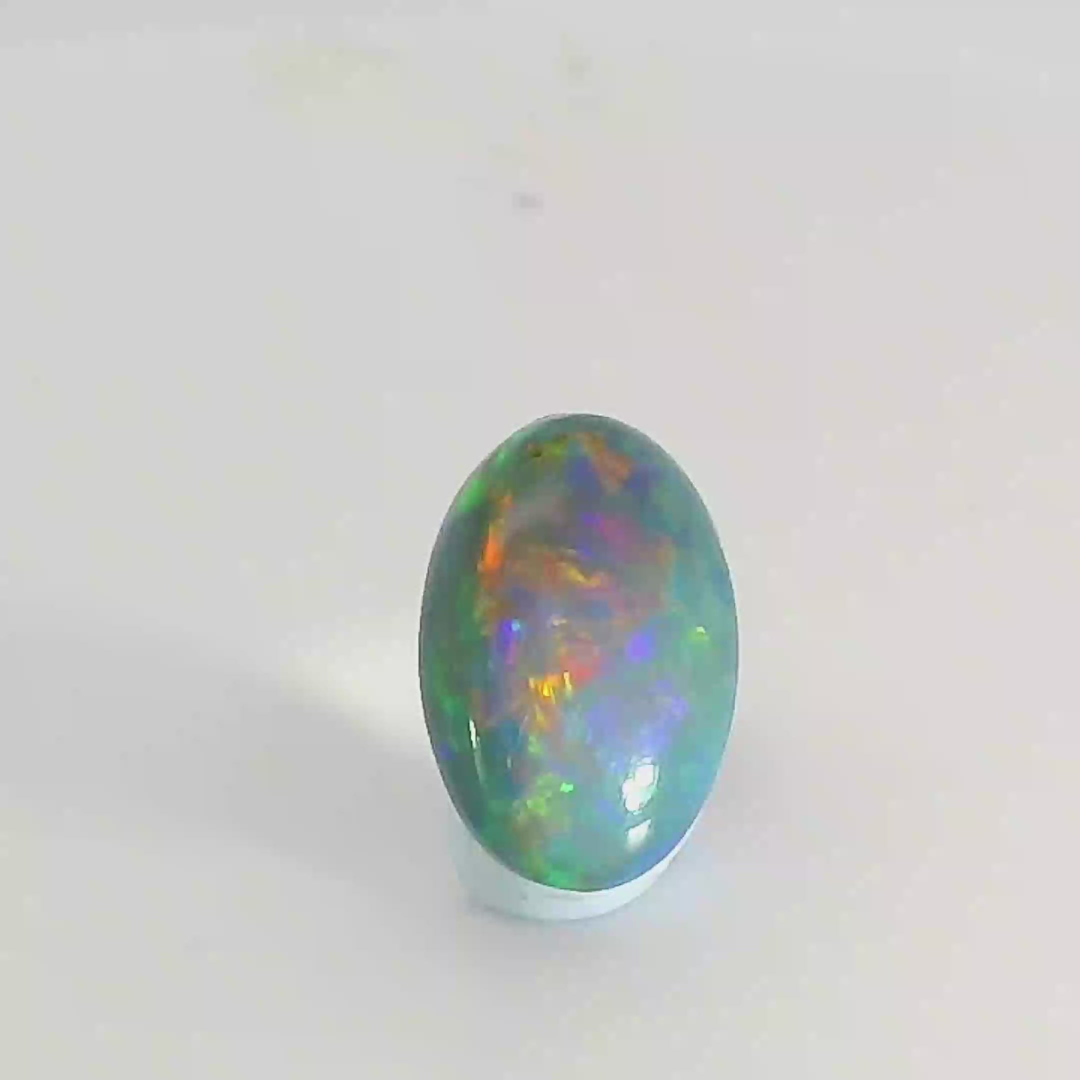 Vibrant Opal Gemstone in Hand