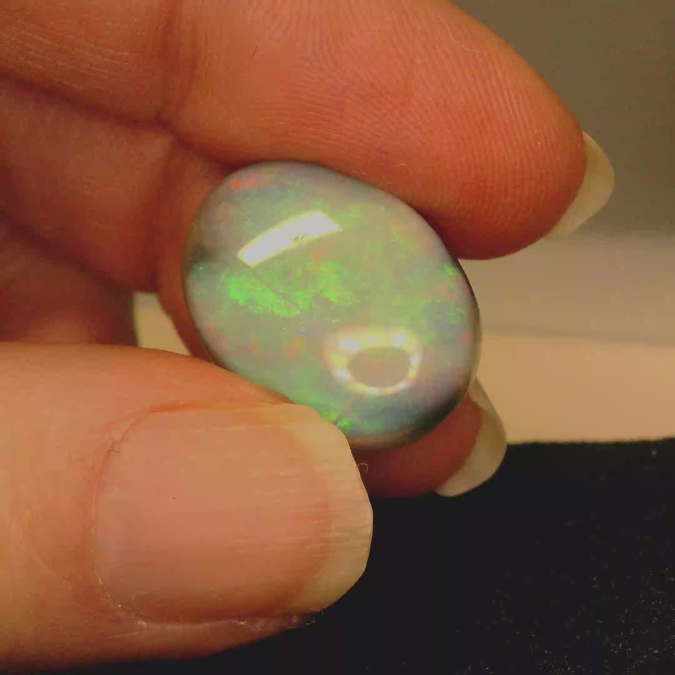Vibrant Opal Gemstone in Hand