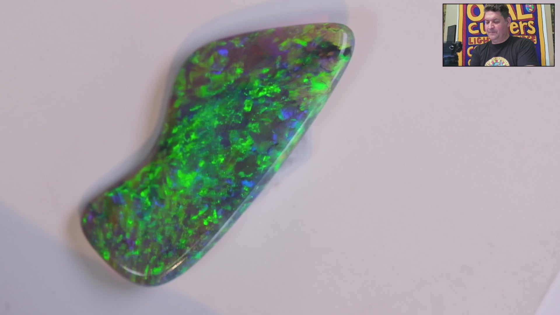 Video of a Multicoloured opal stone on a white background