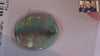Video of a Multicoloured opal stone on a white background