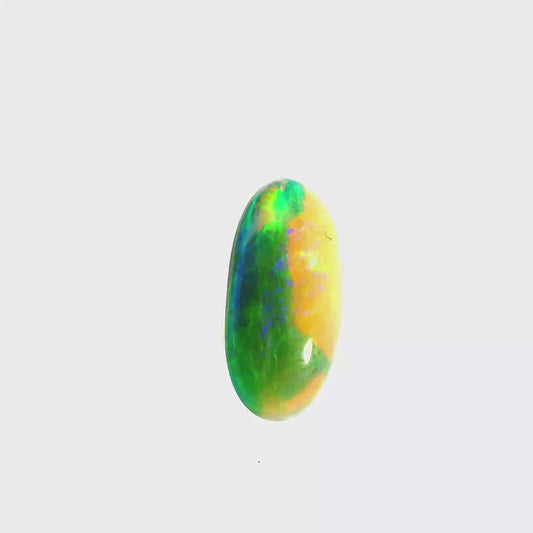 Video of an Multicoloured opal stone on a white background