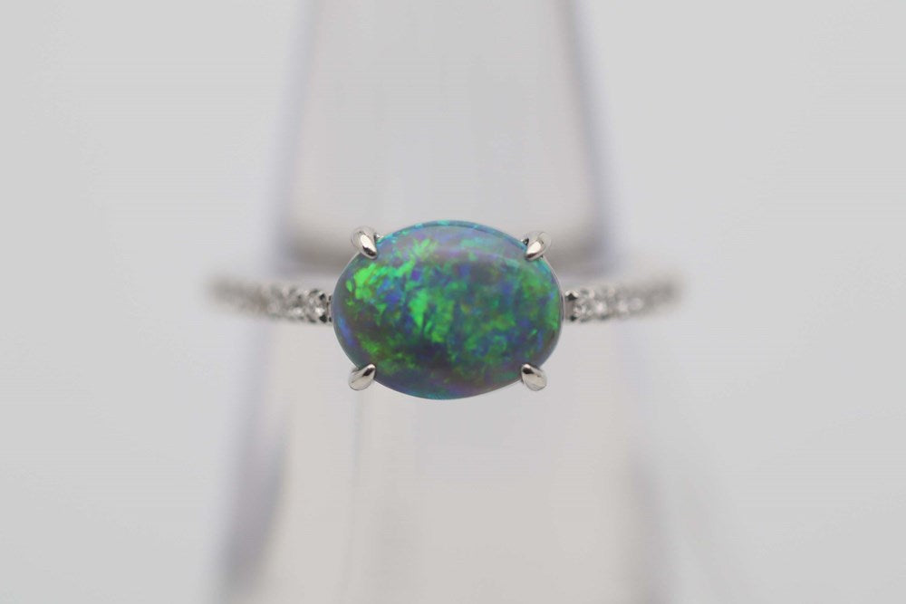Australian Black Opal 1.21 set in a 900 Platinum Ring with 16 Diamonds 0.10Cts