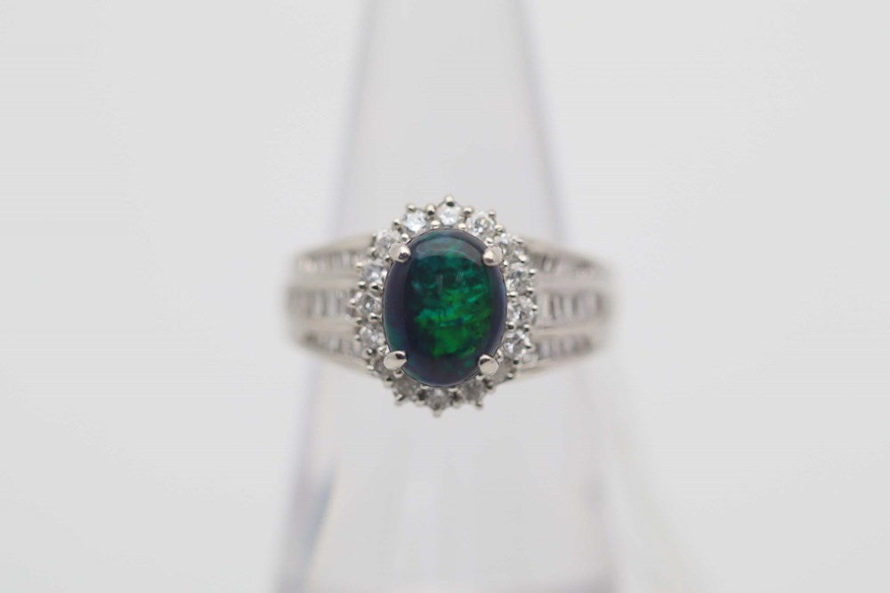 Australian Black Opal 1.67Cts set in a 900 Platinum Ring, Haloed with Diamonds 0.57 Each