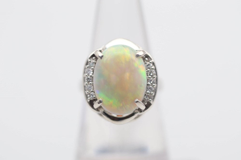 Opal 5.12cts Sunset Rolling Flash Pattern set in a 900 Platinum Ring with 5 Diamonds