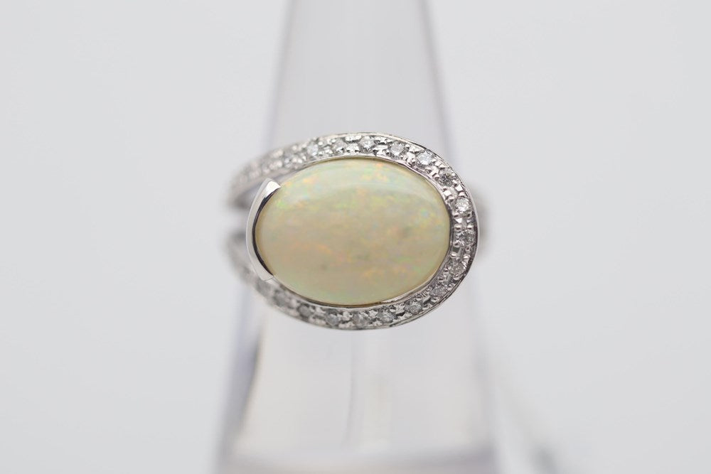 Australian Light Opal 4.47Cts set in 18K White Gold Ring Haloed with Diamonds 0.25Cts each